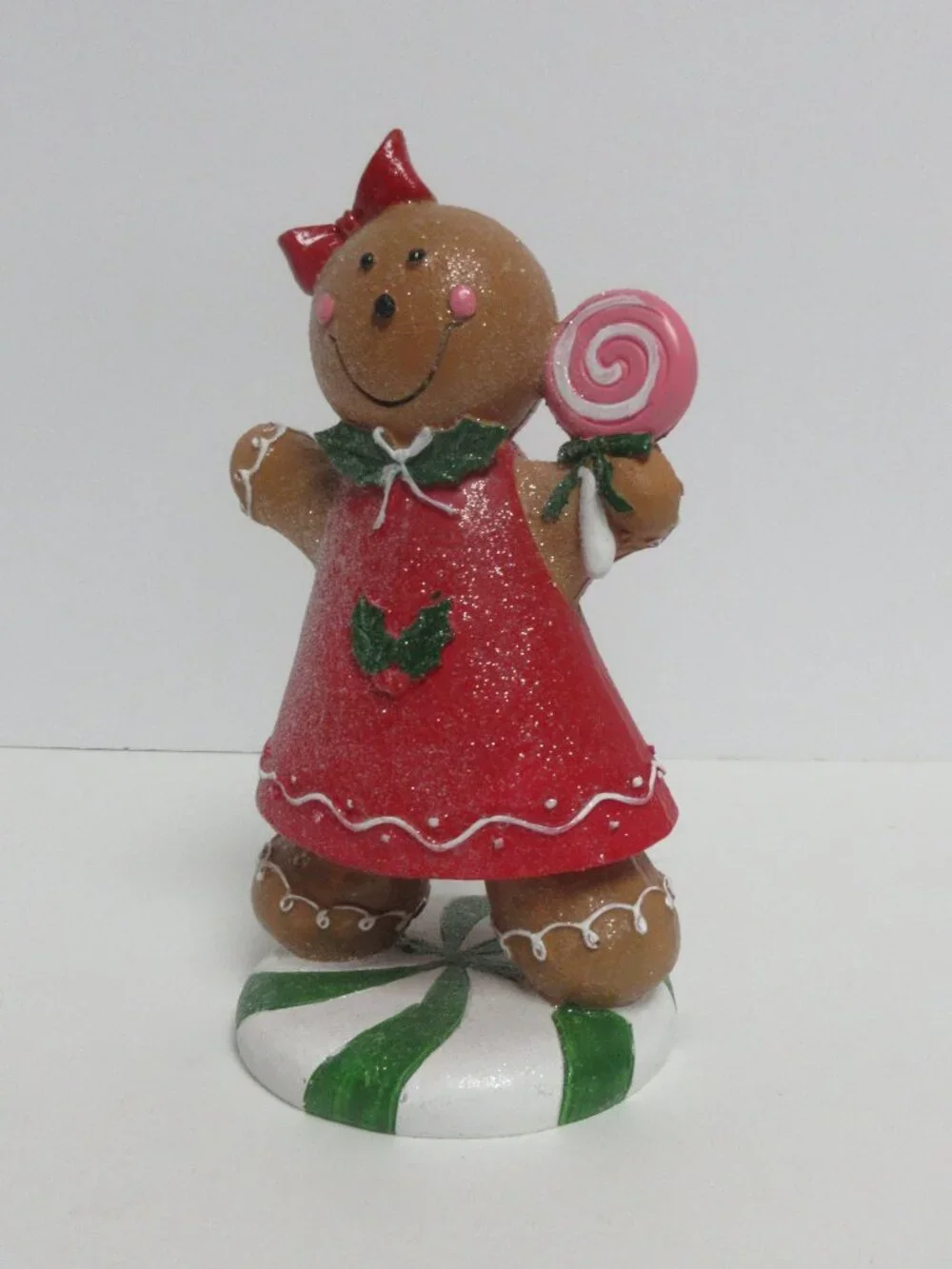 Festive Gingerbread Girl Figurine Holding Pink Lollipop